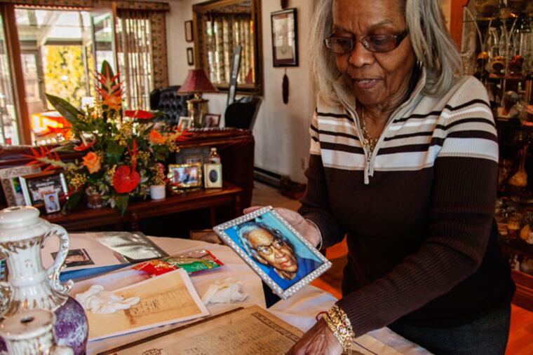 Mary Weston looks over the family records in a 133-year-old Bible in Timbuctoo, Westampton, New Jersey, on Feb. 3, 2015.