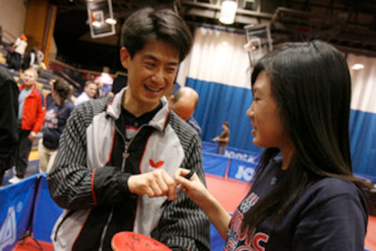 David Zhuang signs autographs after winning the men's U.S. Olympic Table Tennis Trials. The competition concluded yesterday at Drexel University. Zhuang is a five-time U.S. champion.