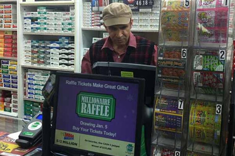 Ashok Kaul of Levittown News & Tobacco tried to figure out which customer bought the ticket before Roger Custer eventually showed up to claim his winnings.