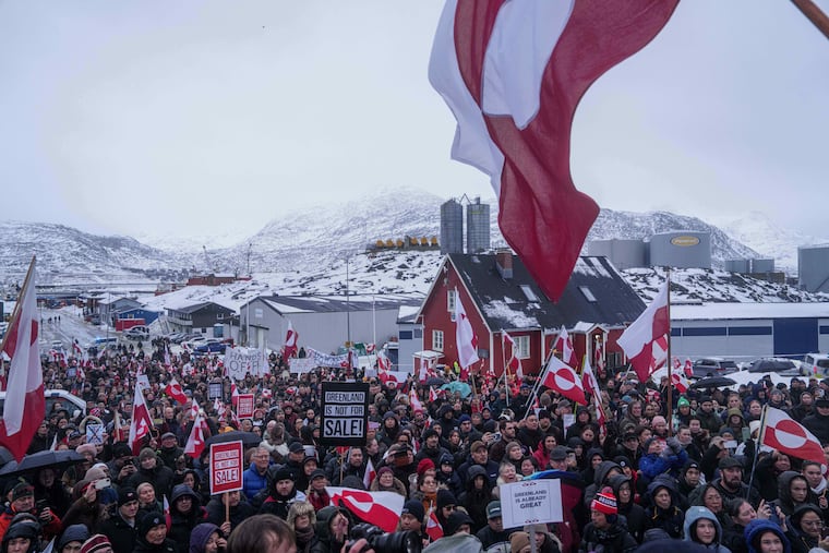 People protest against Trump's policy towards Greenland in front of the US consulate in Nuuk, Greenland, Saturday, Jan. 17, 2026.