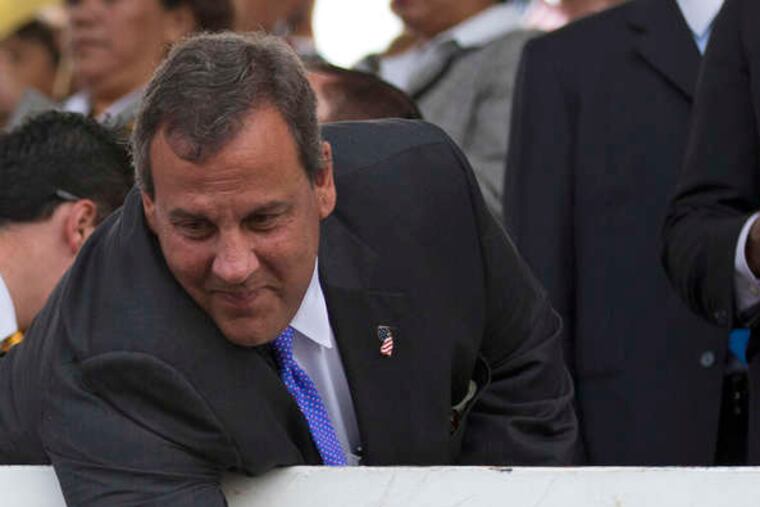 Gov. Christie reaches to shake hands with cheering students during a visit to Puebla on Friday, the last leg of a three-day trade mission to Mexico.