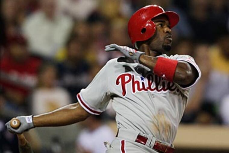 Jimmy Rollins went 3-5, drew a walk and scored two runs last night against the Padres. (AP Photo/Gregory Bull)