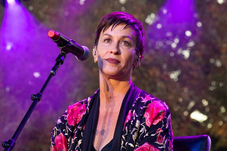 FILE - This Dec. 2, 2018 file photo shows singer Alanis Morissette at One Love Malibu in Calabasas, Calif. Morissette is pregnant with her third child. The Grammy-winning singer posted a black-and-white photo of herself Monday to her Instagram account, revealing her round belly while also singing with headphones covering her ears. Her representative confirmed the pregnancy to The Associated Press. (Photo by Amy Harris/Invision/AP, File)