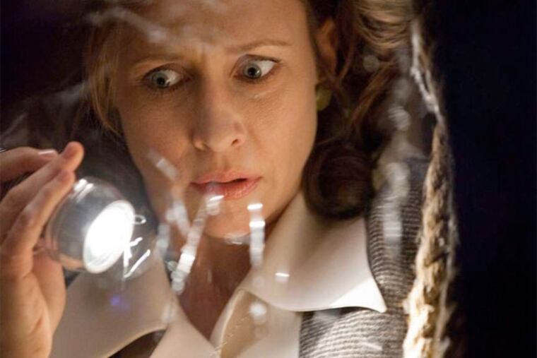 Vera Farmiga plays Lorraine Warren , a demonologist investigating paranormal activity in a Rhode Island house. MICHAEL TACKETT