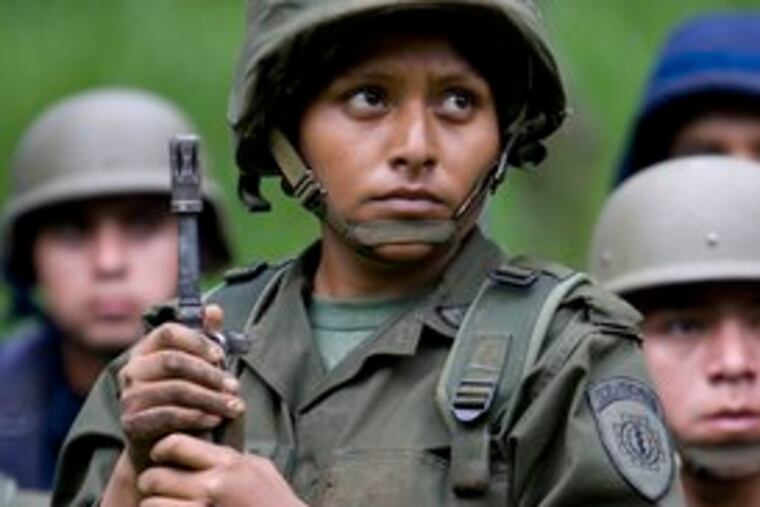 A cadet holds her position. Women now may train to become engineers, pilots - even, ultimately, generals.