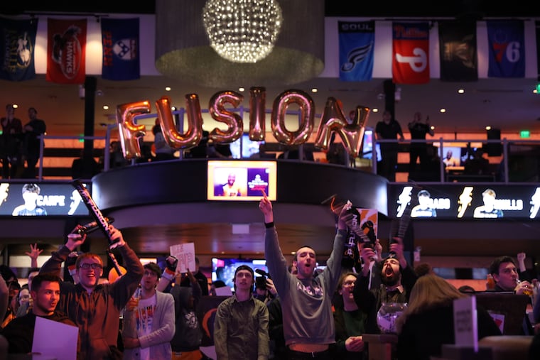 Philadelphia Fusion fans cheer at the Overwatch League season opener watch party
