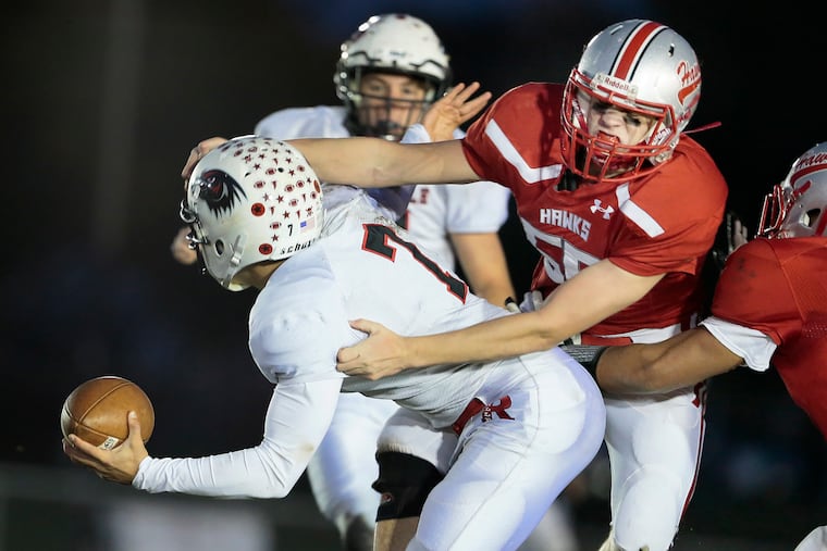 Haddon Township's Matt Gauld sacks Robbinsville quarterback Danny Surtz in the first half Saturday. Robbinsville won, 8-2.