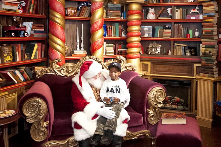 Anthony Sierra, 5, visits Santa in the 2,000-square-foot Dreamworks Santa holiday cottage at the Cherry Hill Mall. ( RON TARVER / Staff Photographer )