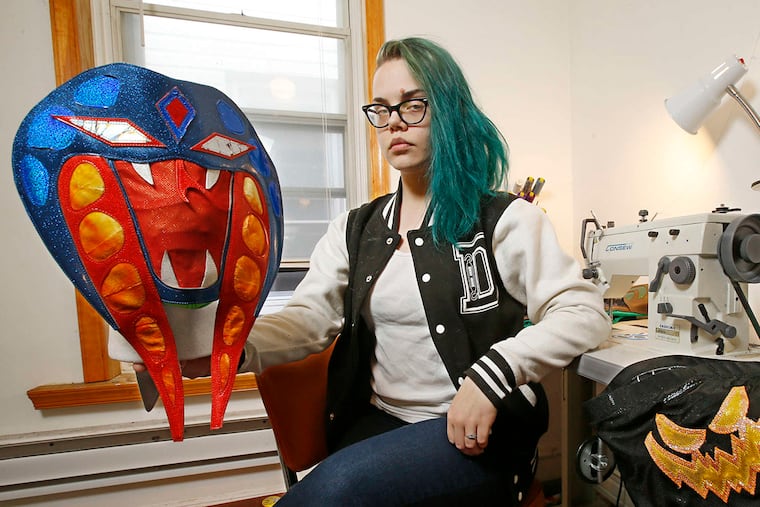 Kate Nyx with a mask she created for her husband, Ophidian the Cobra, a Chikara wrestler. Her work will get main-event treatment this weekend at the Chikara tournament.