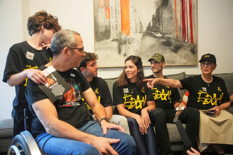 Relatives and friends of Israeli-American soldier Edan Alexander gather on Monday, May 12, 2025 to watch the TV broadcast of his release from Hamas captivity in Gaza.