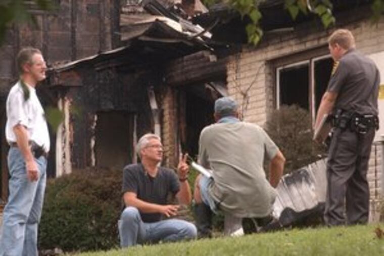 Police and emergency workers at the Twin Spruce personal-care home near Sunbury in 2004 after a fire killed 3 residents. At that time, more stringent rules for fire safety had been beaten back by the personal-care industry.