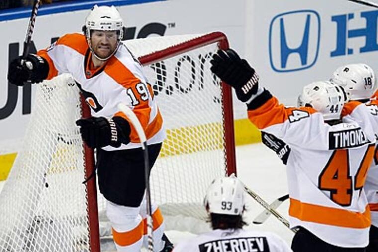 Scott Hartnell celebrates after scoring the tying goal in the third period. (Yong Kim/Staff Photographer)