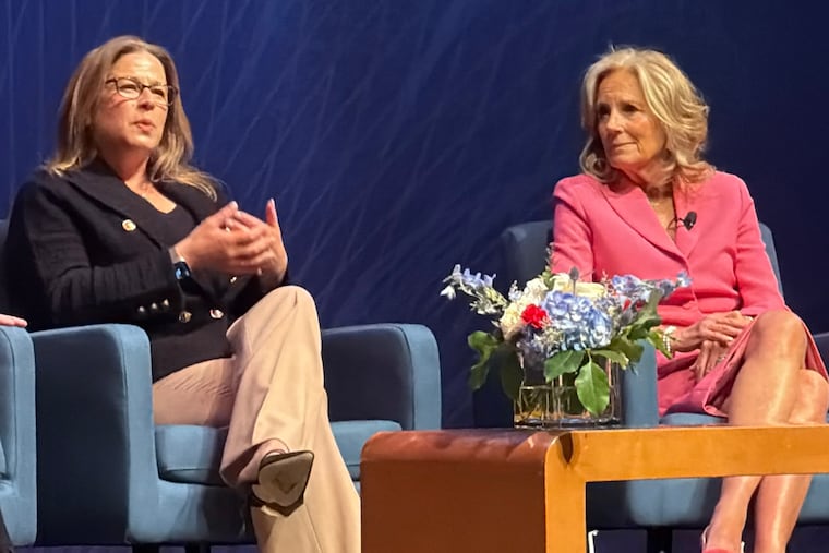 First Lady of Pennsylvania Lori Shapiro (left) speaks at an America 250 PA event for Women's History Month alongside former First Lady Jill Biden.