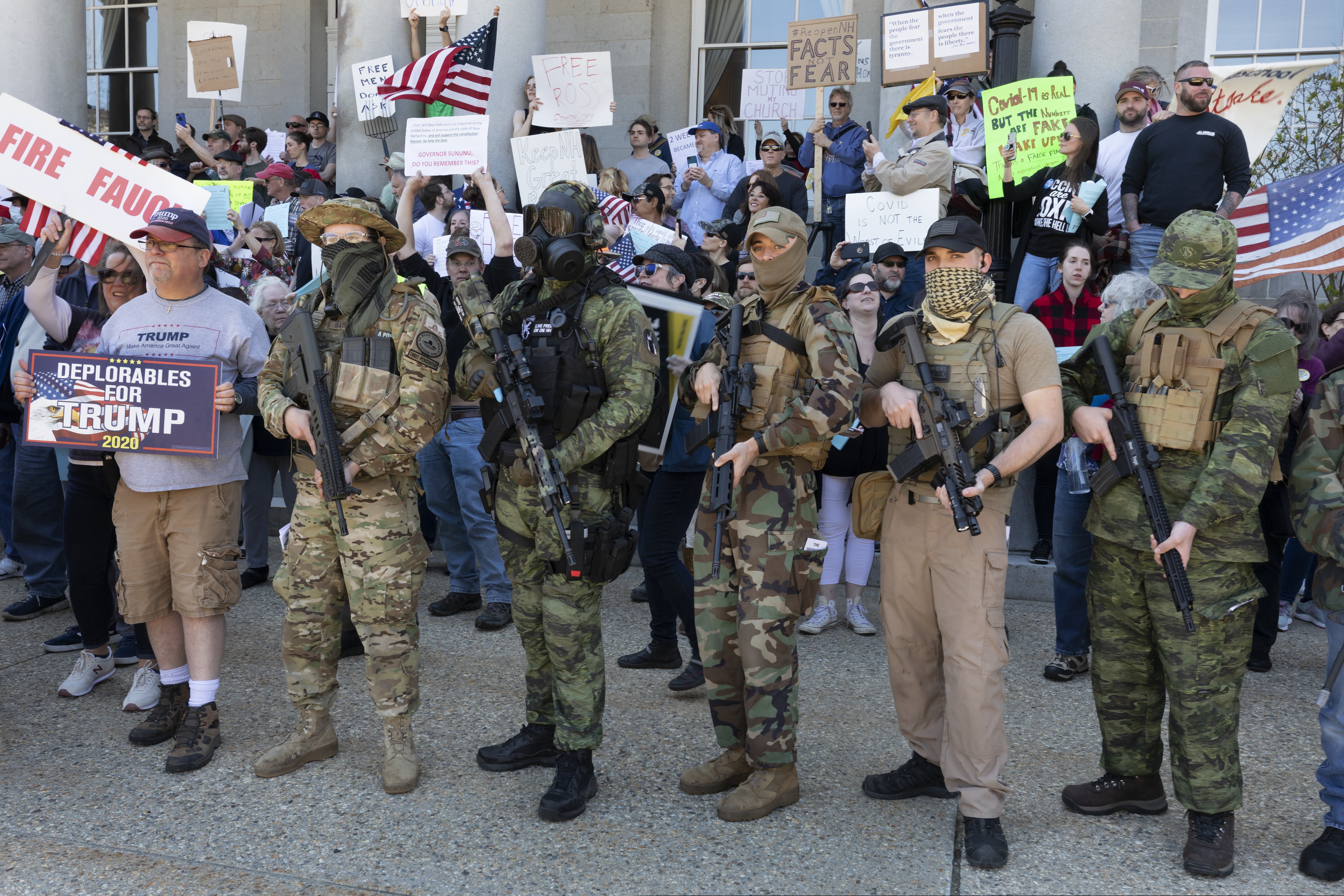 Demonstrators, including some from the boogaloo movement, protest against business closures in Concord, N.H., in May due to COVID-19 concerns.