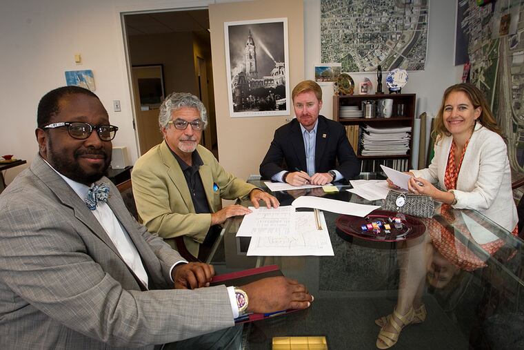 (From left) Curtis J. Gregory, Alan Greenberger, Luke Butler and Sylvie Gallier-Howard. The City Commerce Department is working to answer questions from merchants during the papal visit. (ALEJANDRO A. ALVAREZ/Staff Photographer)