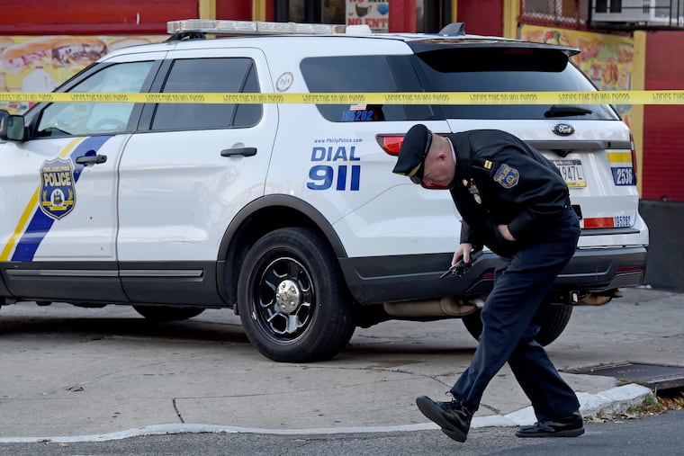 A police captain at the scene on West Pike Street near North 13th Street on Dec. 1, 2021 where an off-duty police officer was shot.