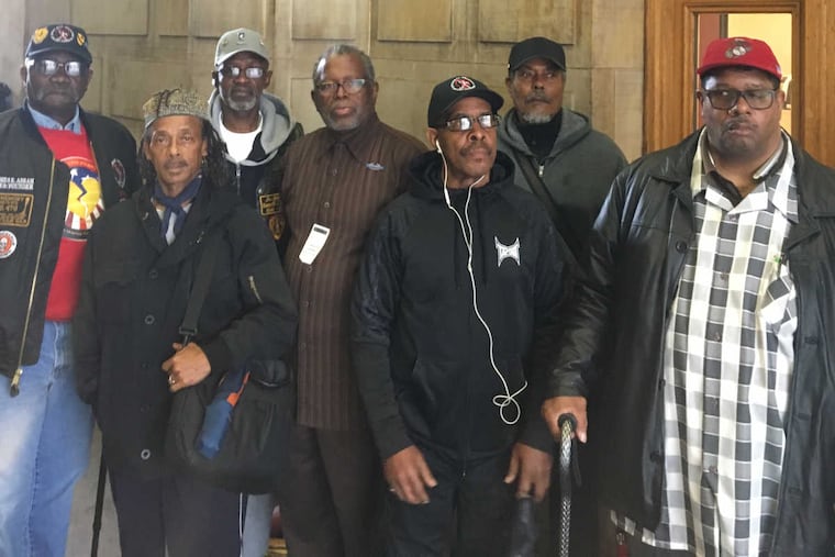 Veterans on Thursday gather outside the Veterans Advisory Commission in City Hall seeking information about the office's budget days after the firing of Executive Dir. Scott Brown.