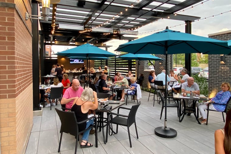 Patio at The Copper Crow in Horsham includes a bar.