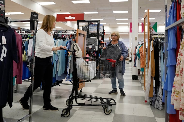 Customers shop at a retail store in Vernon Hills, Ill., on June 12.