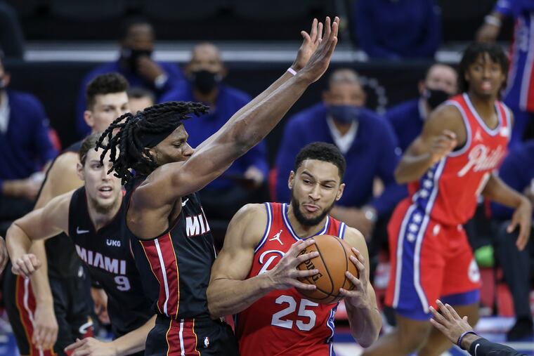 Sixers' Ben Simmons drives on the Heat's Precious Achiuwa during the first quarter Thursday night.