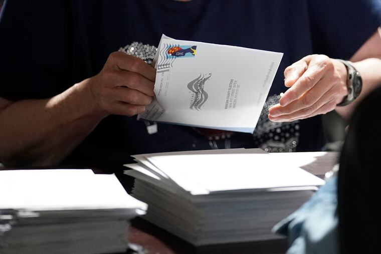 An election worker in Mercer, Pa., counting ballots cast for the Pennsylvania primary election in May.