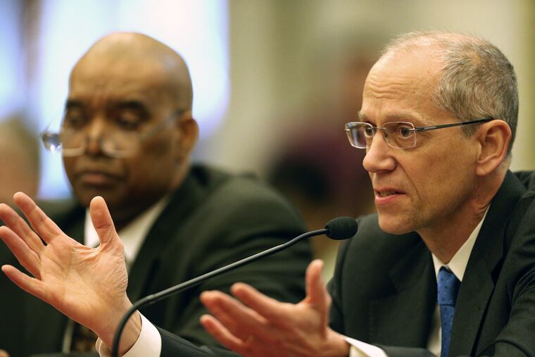 Tom Farley, right, Health Commissioner of Philadelphia, answers a question during a city council hearing on the opioid crisis at City Hall in Philadelphia, PA on March 12, 2018.