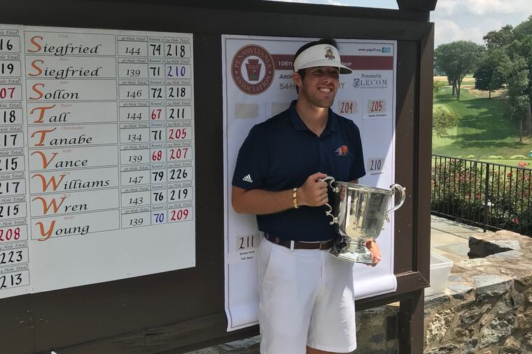 Chris Tanabe holds the championship trophy after winning the Pennsylvania Amateur. JOE JULIANO / Staff