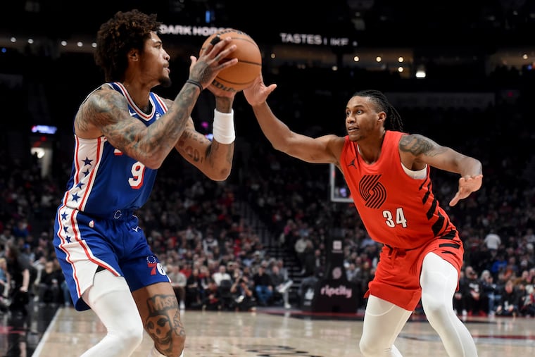 Sixers guard Kelly Oubre Jr. looks to get past the Trail Blazers' Jabari Walker during Monday's game in Portland.