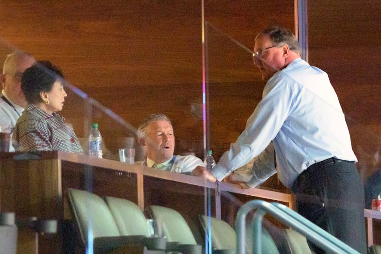 New Orleans Saints and Pelicans owner Gayle Benson, left, talks with Saints President Dennis Lauscha, right, next to VP Greg Bensel, center, during the second half of an NBA game against the Los Angeles Clippers in New Orleans on Sunday, March 14, 2021.