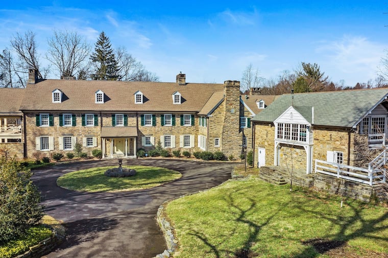 The property includes a renovated barn, which houses a two-car garage on the first floor and a mirrored dance studio on the second.