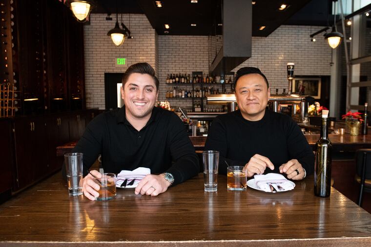 Glu Hospitality co-founders Derek Gibbons (left) and Tim Lu (right) pose for a portrait at their Italian restaurant Figo in Northern Liberties. The once rapidly-growing restaurant group shut down on Tuesday, March 19, 2025, amid several lawsuits and a Pennsylvania Department of Labor investigation.
