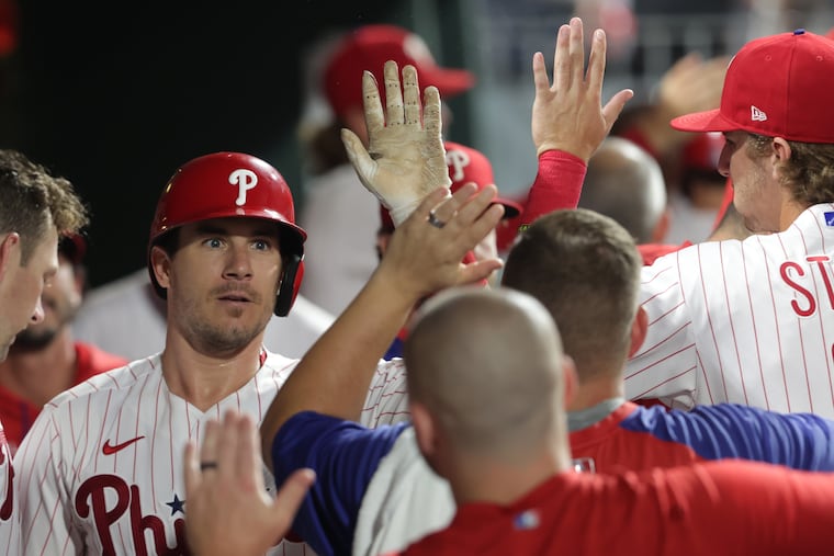J.T. Realmuto, left, of the Phillies celebrates his 4th inning home run against the Marlins on August 9, 2022.