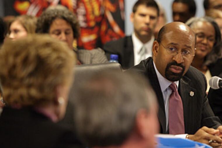 Philadelphia Mayor Michael Nutter and City Council members discuss budget cuts from city services yesterday. (Yong Kim / Staff Photographer)