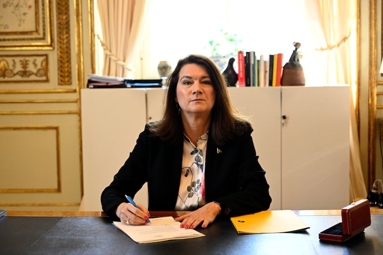 Swedish Minister of Foreígn Affairs Ann Linde poses for photographers as she signs Sweden's application for NATO membership at the Ministry of Foreign Affairs in Stockholm on Tuesday.