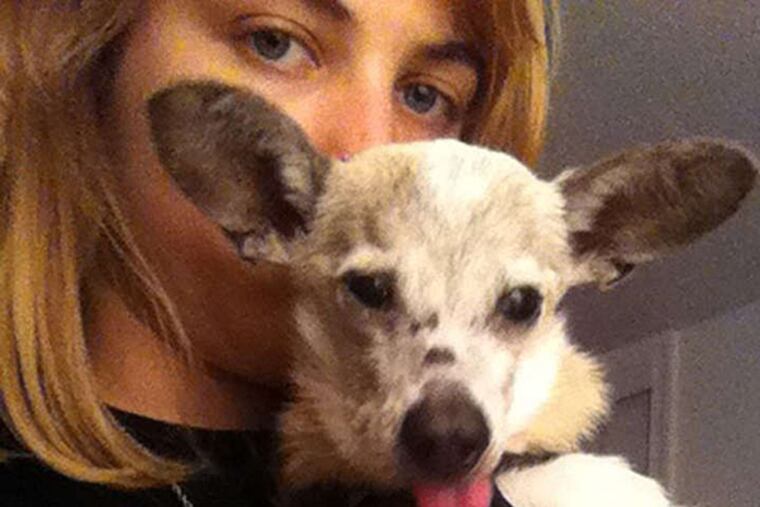 Cailin Mulvihill holds her dog Rhonda, who was euthanized in violation of shelter policy.