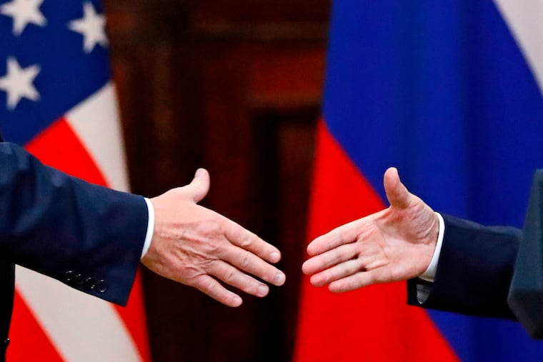 President Donald Trump shakes hand with Russian President Vladimir Putin at the end of a news conference after their meeting at the Presidential Palace in Helsinki, Finland in July 2018.