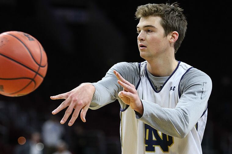 Notre Dame's Steve Vasturia throws a pass during practice.
