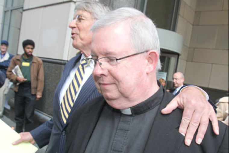 The conspiracy and child sex-abuse trial began March 26, 2012, for two Archdiocese priests. Msgr. William Lynn leaves the Criminal Justice Complex at 12th and Filbert streets. through a mob of media after a lunch recess. His one attorney, Thomas Bergstrom, is next to Lynn. ( Charles Fox / Staff Photographer )