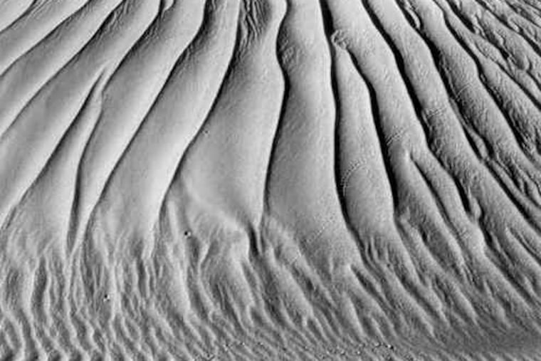"Dunes, Oceano," 1936. Weston reduced nature to elemental forms in studies of shadow and light. A hundred of his prints are on display at James A. Michener Art Museum, Doylestown.