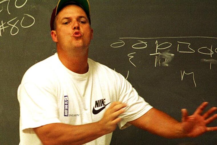 In this 1997 photo, Haddon Heights coach Al Mailahn tells his team take
they need to move some players off the line of scrimmage.
(Michael Plunkett)