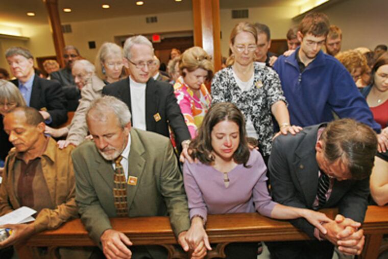 Defendants (from left, front) Kemah C. Washington, Phil Jones, Miriam Copp and Darrell Boyd are joined by supporters, who led prayers for them and walked with them to court. (Alejandro A. Alvarez / Staff Photographer)