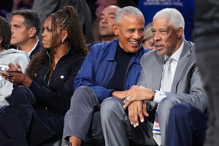 Barack Obama talks to Julius Erving during the NBA All-Star basketball game Sunday, Feb. 15, 2026, in Inglewood, Calif. The former president clarified a remark about extraterrestrial life he made on a podcast.