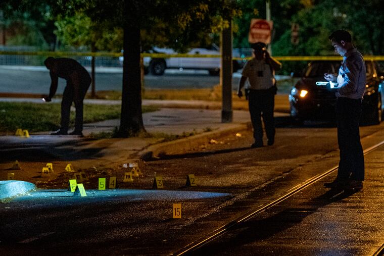 Police investigators are on the scene of a shooting at night June 22, 2020 that left two 15-year-olds injured near 11th and Cambridge streets.