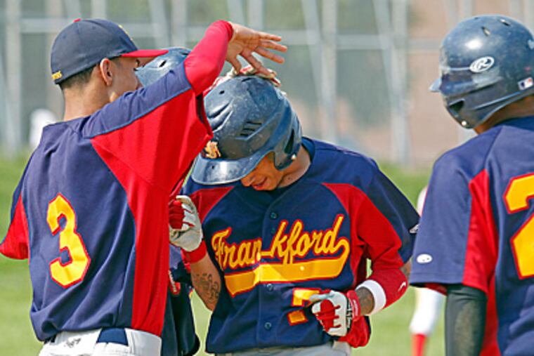 Frankford's Israel Diaz is congratulated by teammate Agusto Ortega after hitting a home run. (Akira Suwa/Staff Photographer)