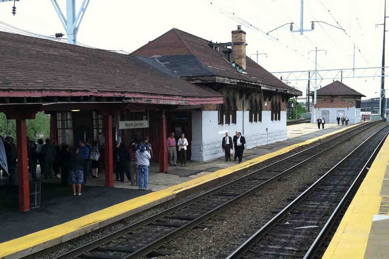 Passengers wait for a train at Wayne Junction station. Handing over the federal aid check, Federal Transit Administrator Peter Rogoff said the stop's remodel was "long, long overdue."