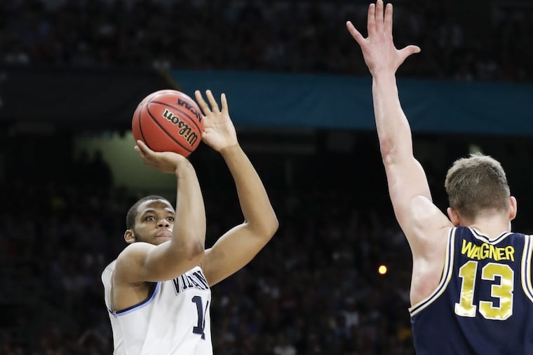 Villanova forward Omari Spellman shoots over Michigan big man Mo Wagner during last year’s NCAA championship game.