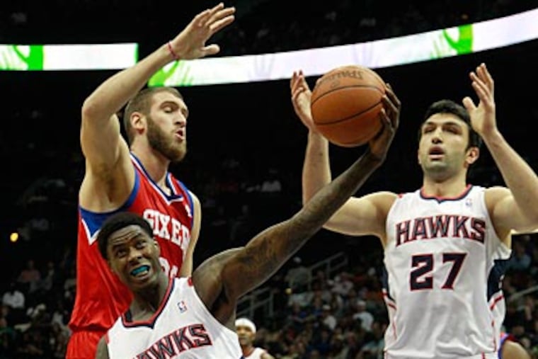 Spencer Hawes, who missed 11 games due to injury, returned to the Sixers lineup on Saturday night. (John Bazemore/AP)