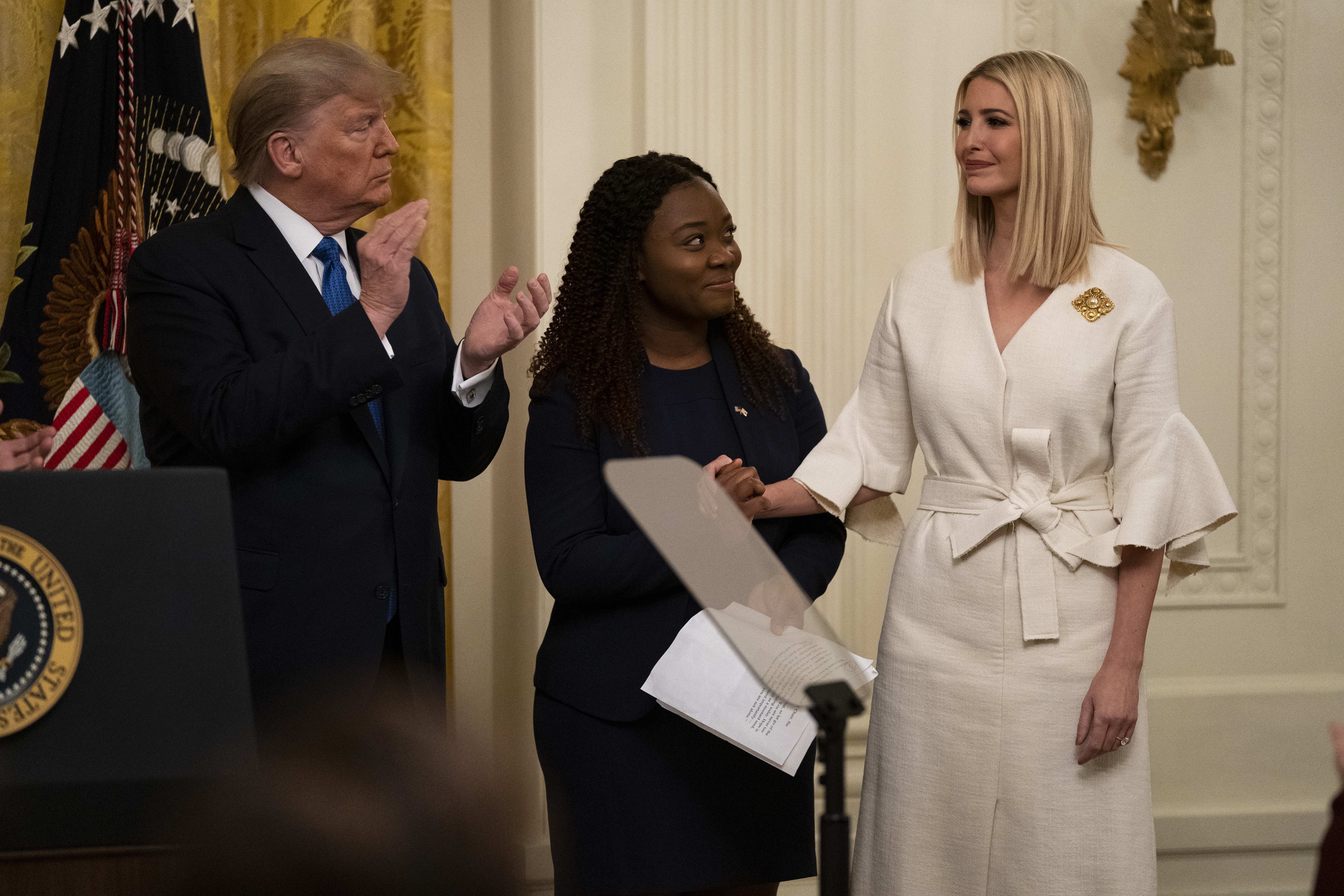 President Donald Trump and survivor Bella Hounakey applaud Ivanka Trump during a January event on human trafficking.