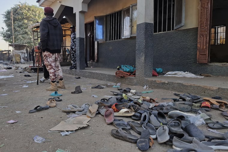 Flip-flops belonging to worshippers are seen following a deadly bomb explosion at a mosque in Maiduguri, Nigeria.