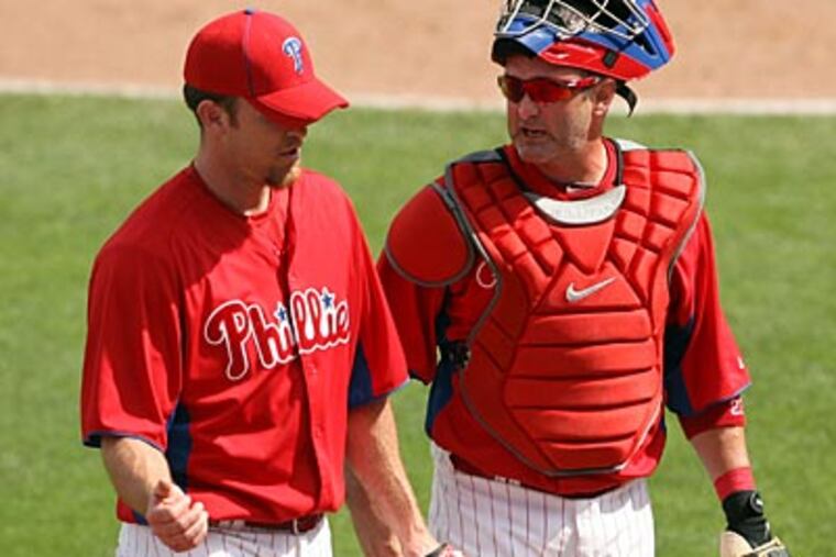 Brad Lidge, left, will likely start the regular season on the disabled list. (Yong Kim/Staff Photographer)